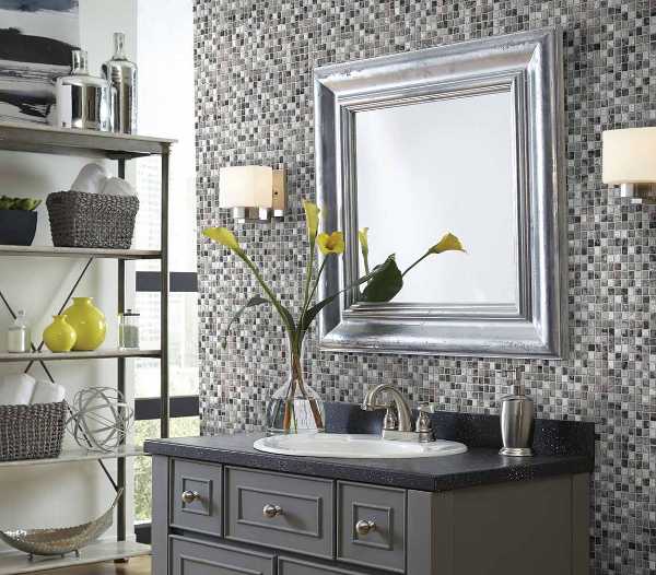 transitional bathroom with gray vanity and mosaic tile